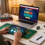 Player engaging in CM88 live blackjack on a tablet, surrounded by strategy notes in a cozy home office.